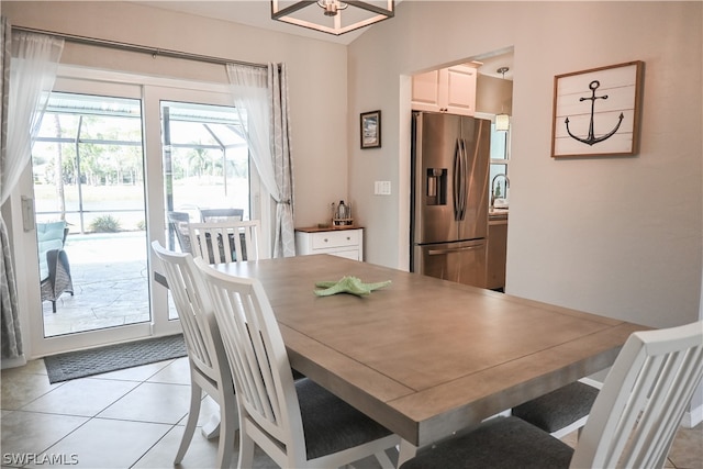 dining area featuring light tile flooring