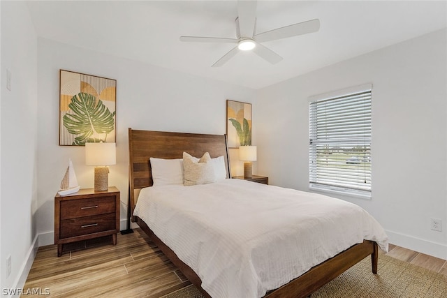 bedroom featuring ceiling fan and light wood-type flooring