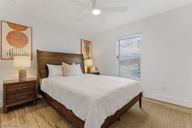 bedroom with hardwood / wood-style floors and ceiling fan