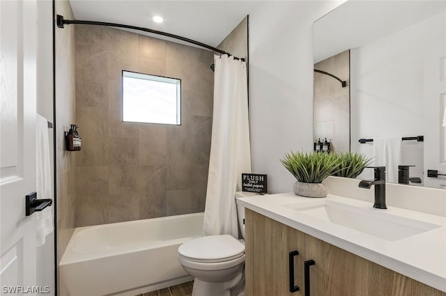 full bathroom featuring shower / tub combo, toilet, and vanity