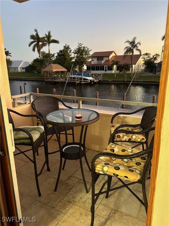 balcony at dusk with a water view