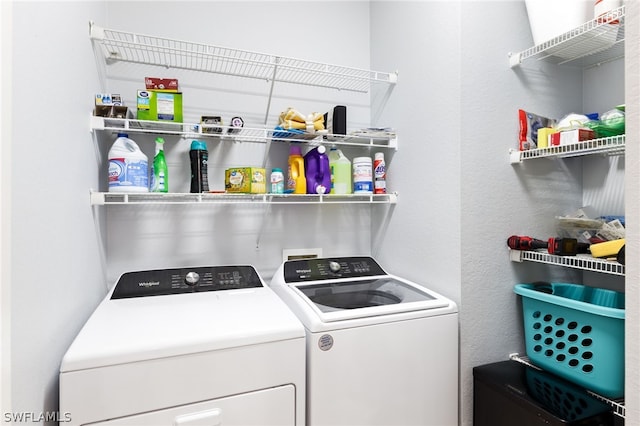 washroom with washer and dryer