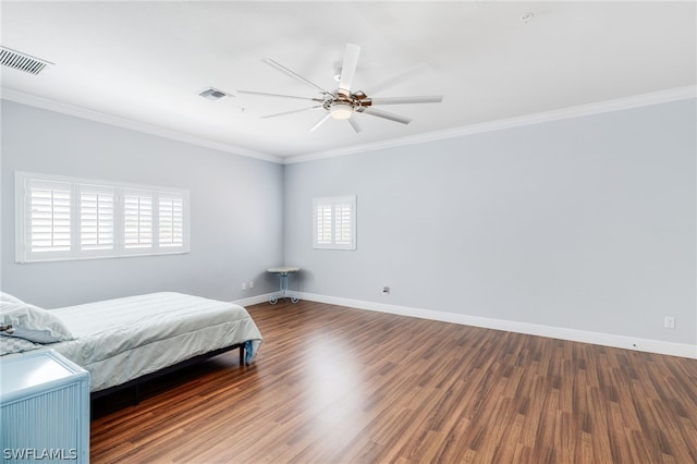 bedroom with ceiling fan, dark hardwood / wood-style flooring, and crown molding