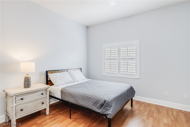 bedroom featuring ceiling fan and light hardwood / wood-style flooring