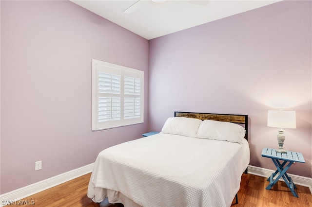 bedroom featuring ceiling fan and wood-type flooring