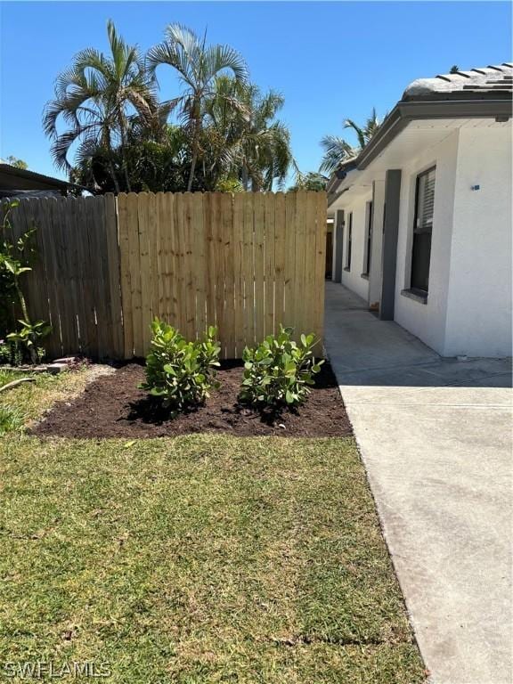 view of yard featuring a patio area and fence