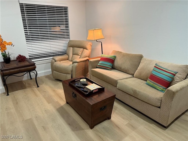 living room with light wood-style floors and baseboards