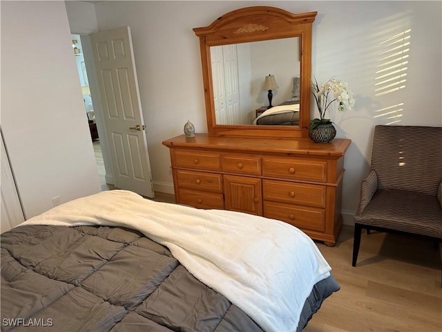 bedroom with light wood-type flooring