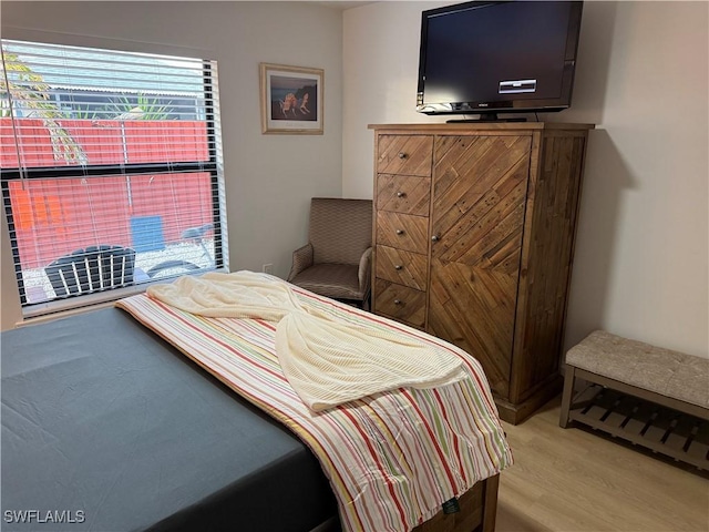 bedroom with light wood finished floors