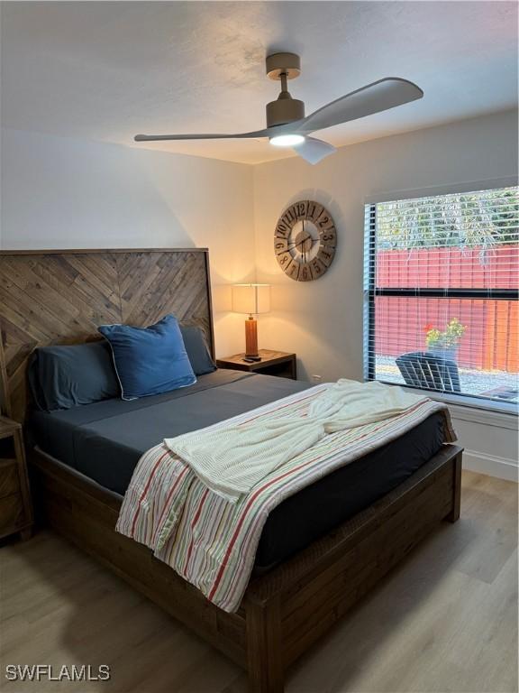 bedroom featuring wood finished floors and a ceiling fan