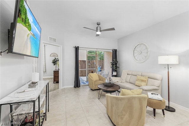 tiled living room featuring ceiling fan