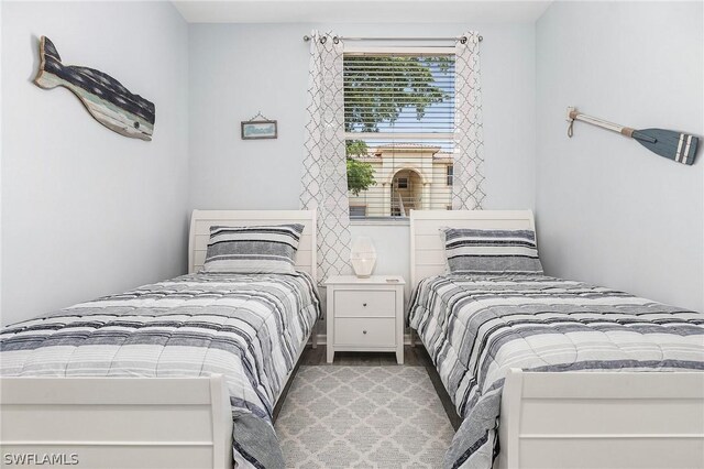 bedroom with hardwood / wood-style floors