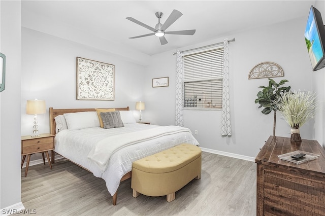 bedroom featuring light wood-type flooring and ceiling fan