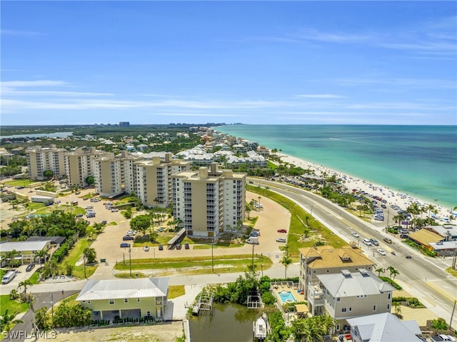 birds eye view of property featuring a view of the beach and a water view