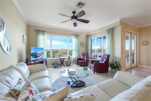 living room with ceiling fan, crown molding, and french doors