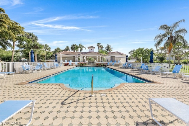 view of swimming pool featuring a patio area