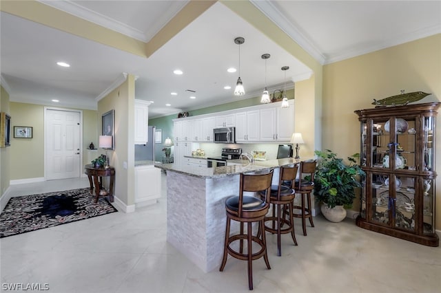 kitchen with white cabinets, light stone countertops, kitchen peninsula, appliances with stainless steel finishes, and light tile floors