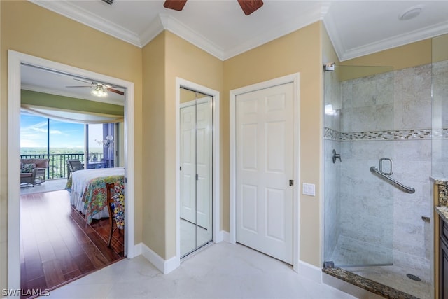 bathroom featuring ornamental molding, ceiling fan, vanity, and tile floors