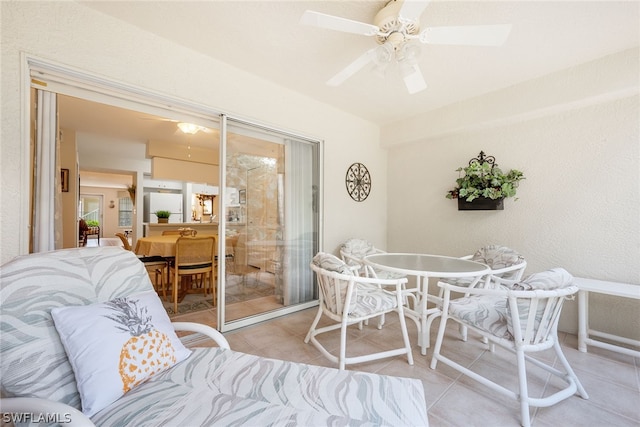 tiled living room featuring ceiling fan