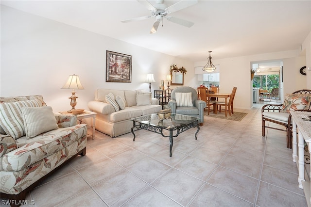 tiled living room with ceiling fan