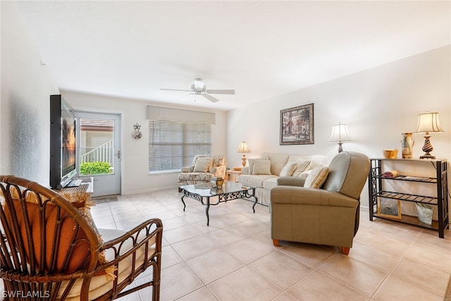 living room with ceiling fan and light tile floors