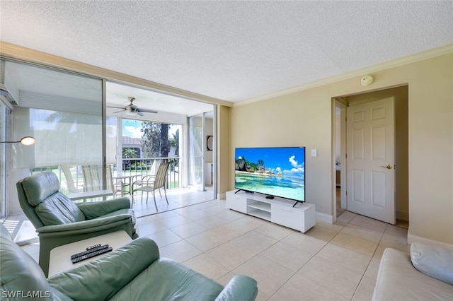 living room with ceiling fan, a textured ceiling, light tile flooring, crown molding, and floor to ceiling windows