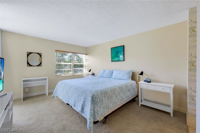 carpeted bedroom with a textured ceiling