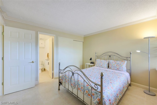 bedroom featuring ornamental molding, light tile flooring, ensuite bathroom, and a textured ceiling