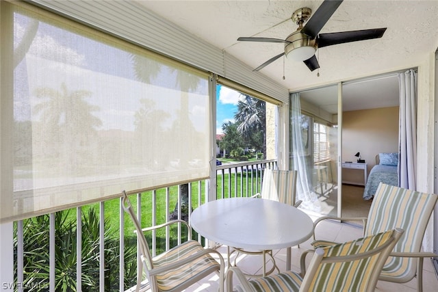 sunroom / solarium with ceiling fan