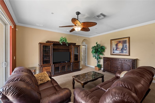 living room with carpet flooring, crown molding, and ceiling fan