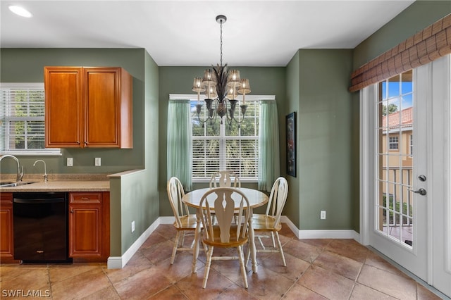 dining space featuring sink, an inviting chandelier, and light tile floors