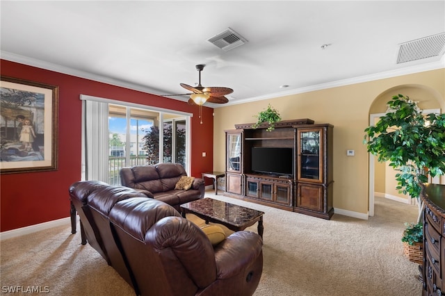 living room with ceiling fan, light colored carpet, and ornamental molding