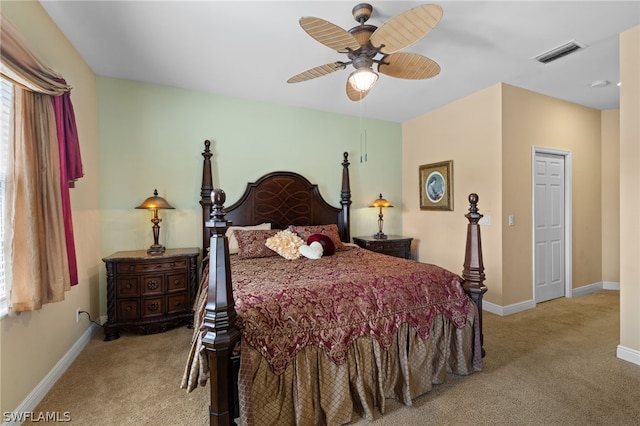 carpeted bedroom with ceiling fan