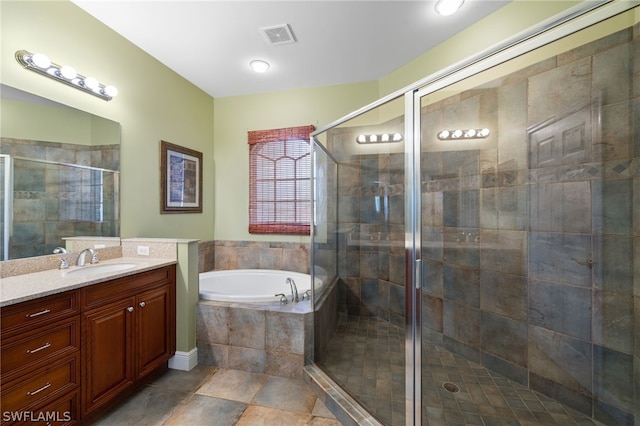 bathroom featuring vanity, tile floors, and shower with separate bathtub