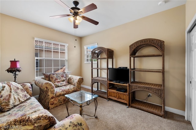 living room with light carpet and ceiling fan