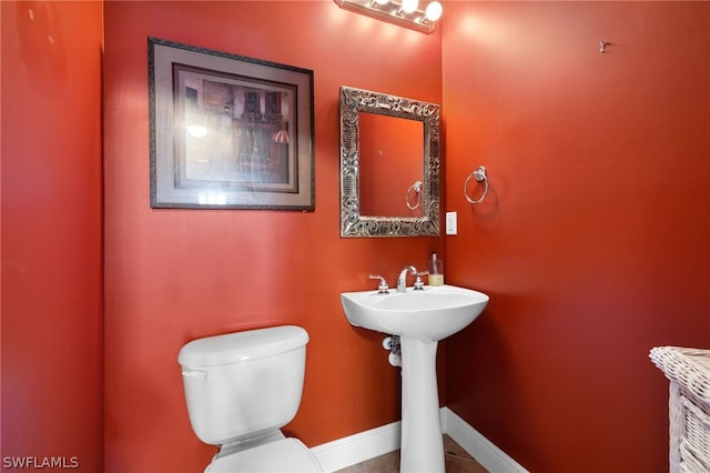 bathroom with sink and toilet