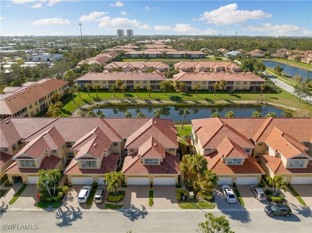 birds eye view of property with a water view