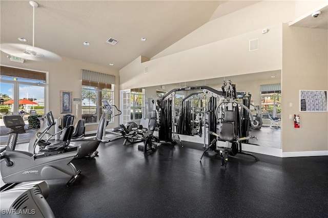 gym with a healthy amount of sunlight and high vaulted ceiling