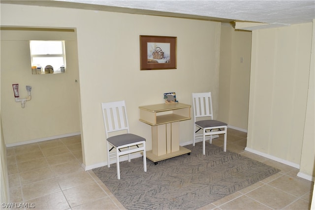 dining space with tile floors