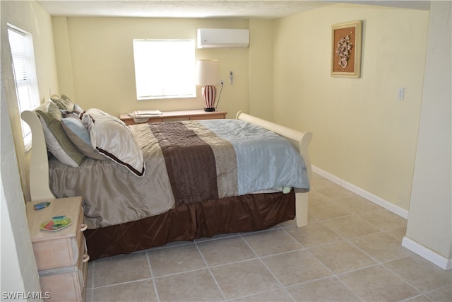 tiled bedroom featuring an AC wall unit and multiple windows