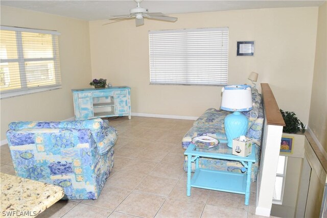 interior space with ceiling fan