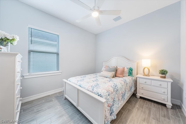 bedroom featuring ceiling fan and light hardwood / wood-style flooring