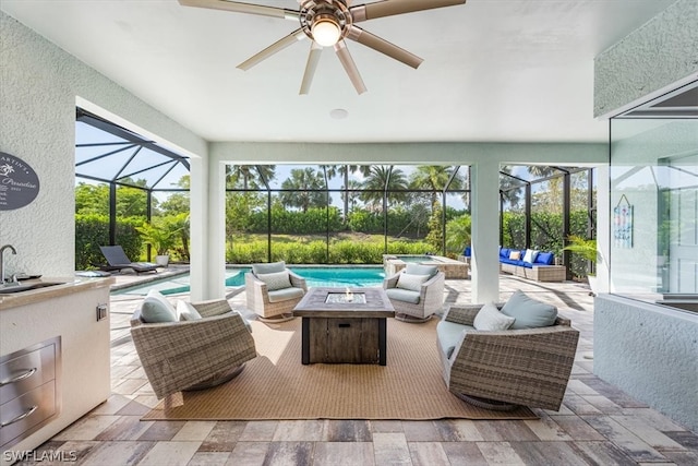 sunroom / solarium featuring a wealth of natural light and ceiling fan