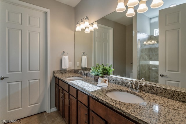 bathroom featuring a shower, tile patterned floors, and vanity