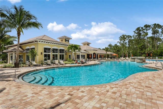 view of swimming pool featuring a patio area