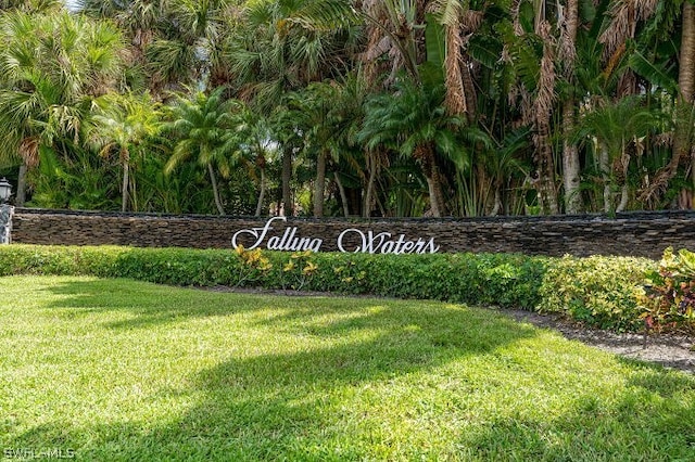 community / neighborhood sign with a lawn