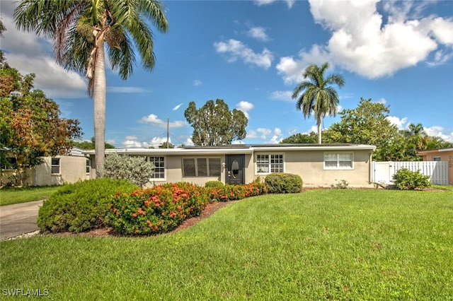 ranch-style home with a front yard