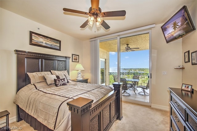 carpeted bedroom with ceiling fan and access to outside