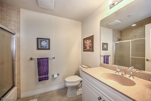 full bathroom featuring tile flooring, vanity with extensive cabinet space, enclosed tub / shower combo, and toilet