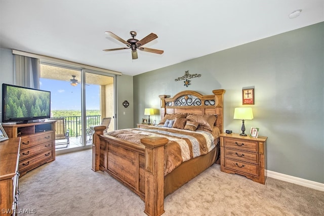 carpeted bedroom with ceiling fan and access to outside